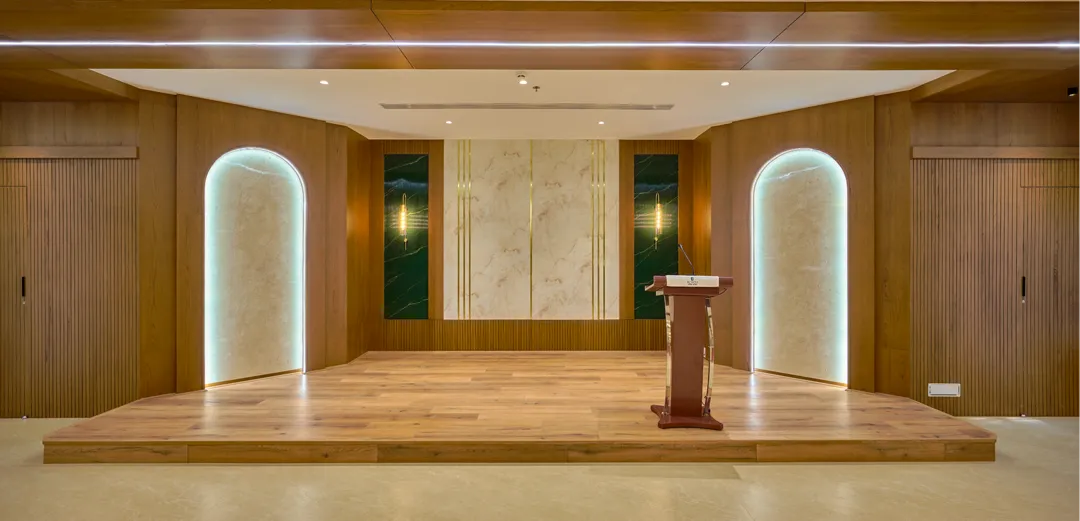 Event stage with podium and decorative wall panels