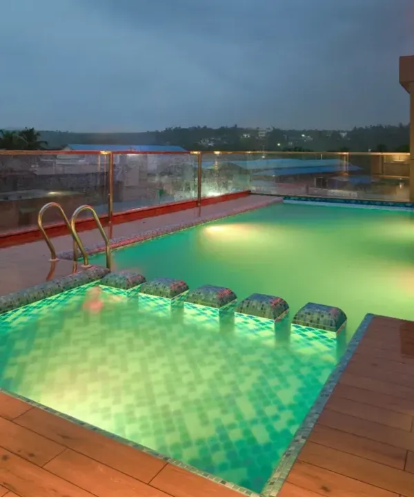 Rooftop swimming pool with deck chairs