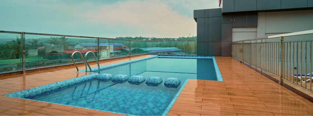 Hotel swimming pool with deck seating