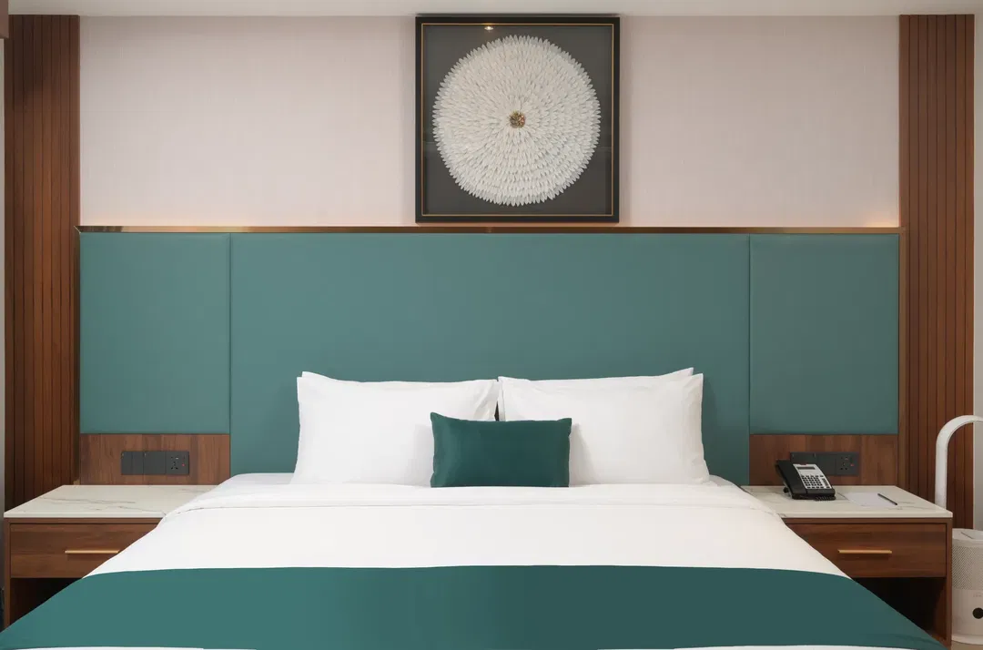Deluxe King room bed-facing view
