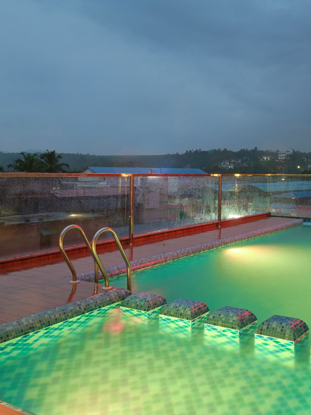 Rooftop swimming pool with deck chairs